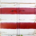 Painted in white and red container door. Royalty Free Stock Photo