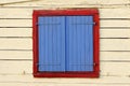 Painted window shutters on bea