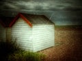 Painted wooden beach hut on shingle beach