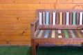 The painted wooden bench with the pastel color on the artificial grass Royalty Free Stock Photo