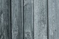 Painted wooden fence. Old gray wood planks, cracked grunge texture. Shabby timber in vintage style. Abstract pattern.