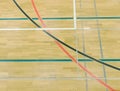 Painted wooden floor of sports hall with colorful marking lines. Schooll gym Royalty Free Stock Photo