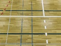 Painted wooden floor of sports hall with colorful marking lines. Schooll gym Royalty Free Stock Photo