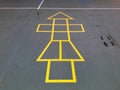 Painted yellow lines contrast against the dark asphalt and form the classic school playground game of Hopscotch Royalty Free Stock Photo