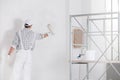 Painter or builder painting a wall white Royalty Free Stock Photo