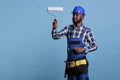 Painter focused on work holding professional roller Royalty Free Stock Photo