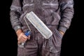 Painter holding paint rollers in his hand. Accessories for small home repairs Royalty Free Stock Photo