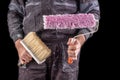Painter holding paint rollers in his hand. Accessories for small home repairs Royalty Free Stock Photo