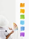 Painter man with color swatches in your hand, Choice of colors c Royalty Free Stock Photo