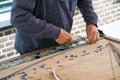 Painter man makes stained glass. Royalty Free Stock Photo