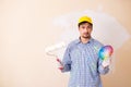 The painter man painting the wall at home Royalty Free Stock Photo