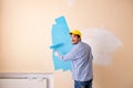 The painter man painting the wall at home Royalty Free Stock Photo