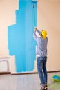 The painter man painting the wall at home Royalty Free Stock Photo