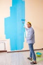 The painter man painting the wall at home Royalty Free Stock Photo