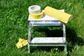 Painter masking tape and sandpaper on ladder Royalty Free Stock Photo