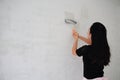 Painter Painting a House Wall with a Paint Roller Royalty Free Stock Photo