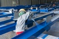 Painter is painting a steel H-beam of steel structure work with spray gun Royalty Free Stock Photo
