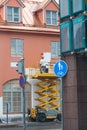 Painter with roller painting house facade in town Royalty Free Stock Photo