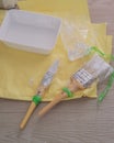 Painter`s brush wrapped in plastic to prevent from drying up. Reusable for next project