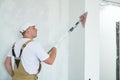 Painter work angle sander. sanding the wall corner surface after putty for painting