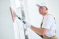 Painter work angle sander. sanding the wall corner surface after putty for painting