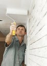 Painter worker painting a ceiling