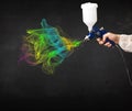 Painter working with airbrush and paints colorful paint Royalty Free Stock Photo