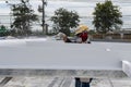 The painter is working to fireproof paint on steel structure with spray gun, at industrial factory