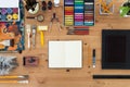 Painter workplace top view. Wooden table of an artist with art tools for drawing. Royalty Free Stock Photo