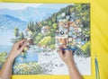 Painting for beginners, a woman draws a picture by numbers with acrylic paints on canvas artist draws a picture, painting a