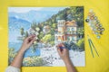 Painting for beginners, a woman draws a picture by numbers with acrylic paints on canvas artist draws a picture, painting a