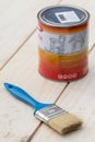 Painting brush with paint bucket on the wooden boards Royalty Free Stock Photo