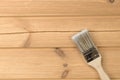 Painting brush on wooden unpainted surfaces Royalty Free Stock Photo