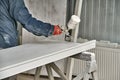 Painting cabinets with spray gun . Painting chamber, spray gun. Furniture manufacture