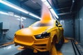 painting and coating system spraying paint onto car, with robotic arm moving in precise motion