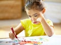 Painting, creative and girl kid with homework, assignment or project for school at home. Colorful, artist and young Royalty Free Stock Photo