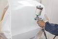 Painting the damaged element body of the car - the door with the Royalty Free Stock Photo