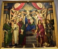 Painting, depicting the Madonna with baby Jesus in her arms, popes and saints angels, at the Uffizi museum in Florence.