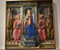 Painting depicting the Madonna and the child Jesus with two saints on the right and left, in the Uffizi museum in Florence.