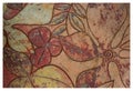 Painting detail of a garden stool with floral pattern.