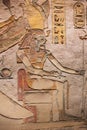 Painting of the divine pharaoh sitting on a throne