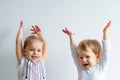 Painting is fun for kids - happy children play with dirty hands. Brother and sister playing with hands in the colorful Royalty Free Stock Photo