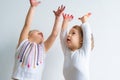 Painting is fun for kids - happy children play with dirty hands. Brother and sister playing with hands in the colorful Royalty Free Stock Photo