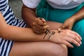 Painting henna on the hand Royalty Free Stock Photo