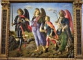 Painting located in the Uffizi museum in Florence, depicting a peaceful scene, three angels walk with a boy with protective air.