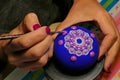 Painting of a stone with the Mandala technique