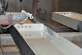 Painting metal structures using an airless sprayer at the factory