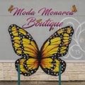 Painting of Monarch Butterflies on a sign for Moda Monarca Boutique in Grand Prairie, Texas.