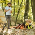 Painting in nature. Start new picture. Beauty of nature. Bearded man woman and cute son relaxing autumn nature. Drawing