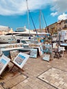 Painting near the yacht in the harbor of Saint Tropez, France Royalty Free Stock Photo